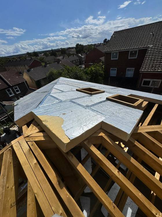 New roof structure with rafters and insulation boards