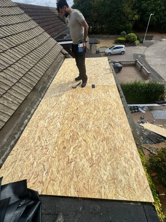 OSB decking being laid on a flat roof